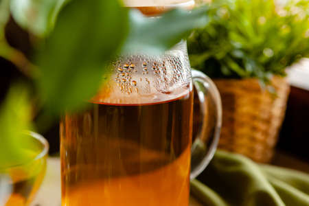 Hot refreshing citrus tea in glass close upの写真素材