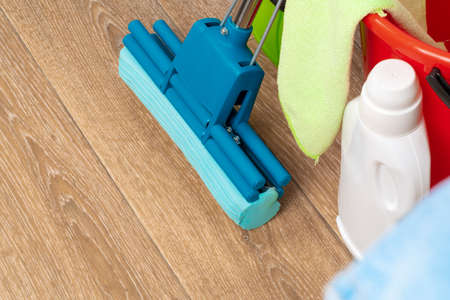 Cleaning tools for house cleaning on wooden floor
