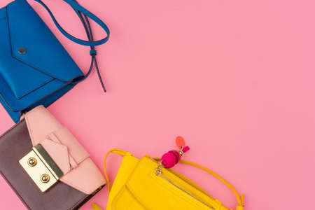 Woman small handbag clutch on a bright pink backgroundの写真素材