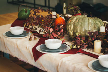 Fall thanksgiving table setting with festive decorの写真素材