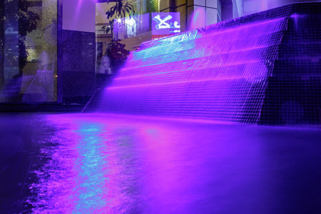Beautiful purple illuminated fountain at night in Dubaiの写真素材