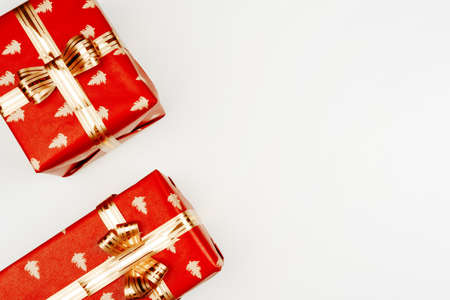 Top view, flat lay of red Christmas gifts on white backgroundの写真素材