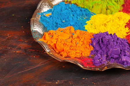 A bunch of colours placed on wooden background close upの写真素材