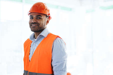 Portrait of young construction engineer wearing hardhat