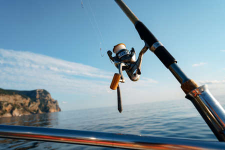 Fishing rod on a sailboat in open sea, close upの写真素材