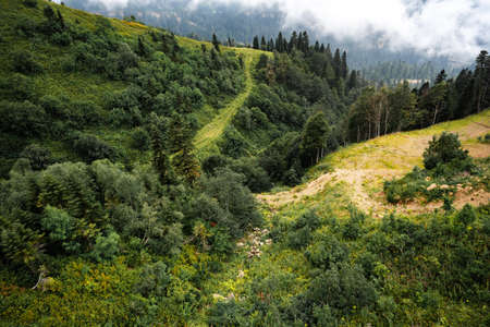 Scenic green mountains and beautiful sky clouds for backgroundの写真素材