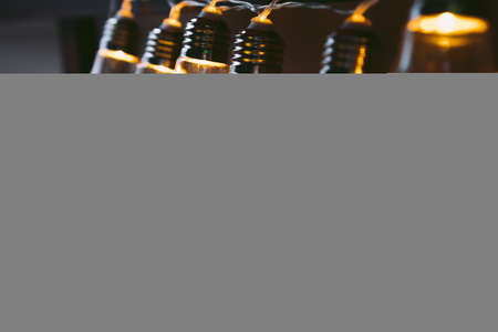 Garland of light bulb lamps in the darkの写真素材