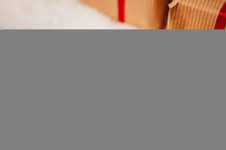 Decorated present on snowy wooden table close upの写真素材