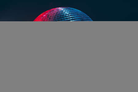 Big disco ball close up on dark backgroundの写真素材