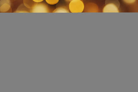 Golden painted pine cone on snowy table, christmas decorの写真素材