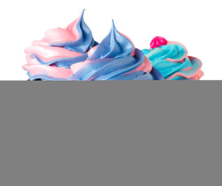 Three tasty cupcakes with cream topping isolated on whiteの写真素材