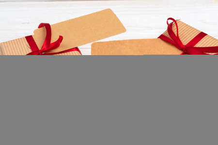empty xmas wish list with little gift on wooden backgroundの写真素材