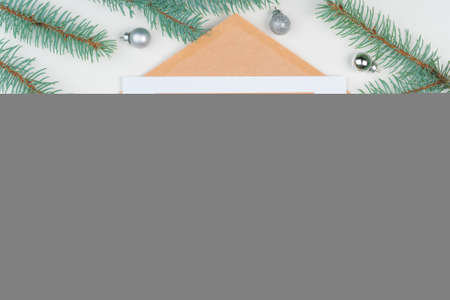 Top view of empty letter on wooden table with christmas decorationの写真素材
