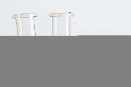 Test flasks with color samples on light grey backgroundの写真素材