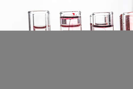 Glass laboratory chemical test tubes with liquid for analysis close upの写真素材