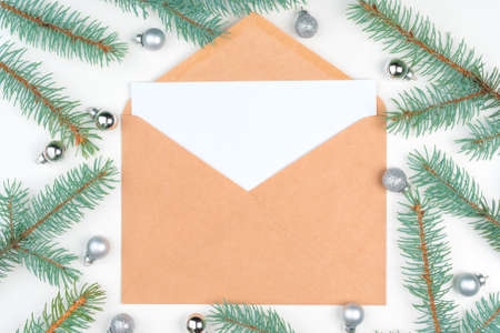 Top view of empty letter on wooden table with christmas decorationの写真素材