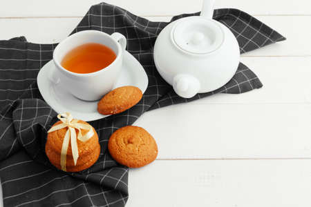 Homemade crunchy cookies and tea on a wooden tableの写真素材