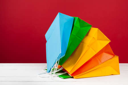 Arrangement of shopping bags on red backgroundの写真素材