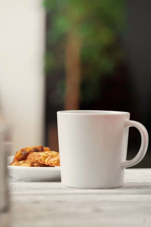 White porcelain cup on kitchen counter close upの写真素材