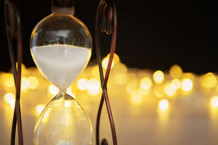Hourglass close up on blurred bokeh background