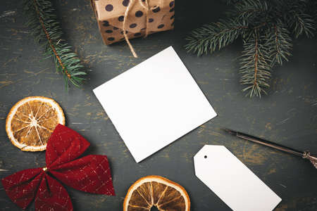 Christmas background with letter, envelope and feather pen surrounded by seasonal decorationsの写真素材