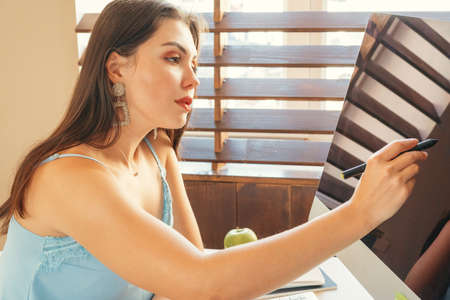 Young woman graphic designer at work in her officeの写真素材