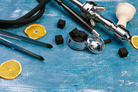 Parts of hookah and fruits on wooden backgroundの写真素材