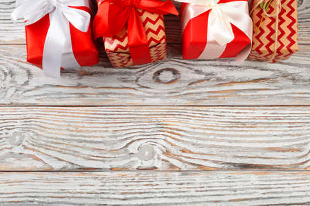 Presents for Christmas holiday on wooden background