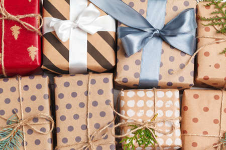 Many colorful gift boxes with ribbons background