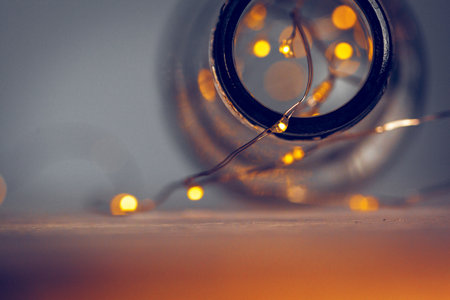 Lights garland in a glass bottle on a dark backgroundの写真素材