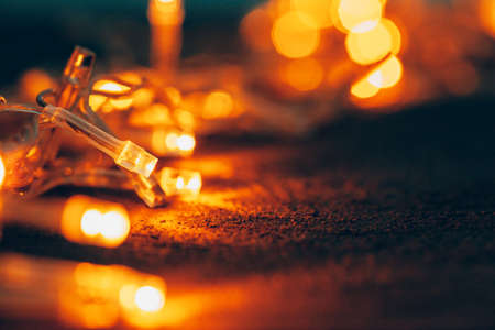 Illuminated garland close up on dark backgroundの写真素材