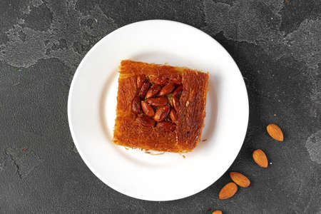 Turkish dessert baklava with nuts on black backgroundの写真素材