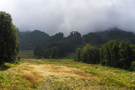 Scenic green mountains and beautiful sky clouds for backgroundの写真素材