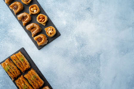 Top view of Turkish desserts on light blue backgroundの写真素材