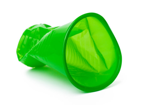 Recyclable crushed plastic cup isolated on white backgroundの写真素材