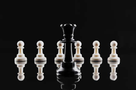 Chess figures on dark black background close upの写真素材