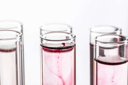 Glass laboratory chemical test tubes with liquid for analysis close upの写真素材