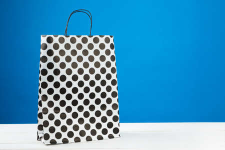 Arrangement of shopping bags on blue backgroundの写真素材