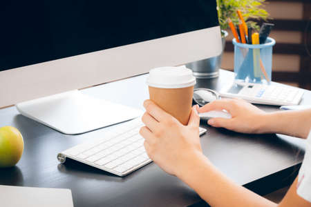 Business woman at work with laptop close up