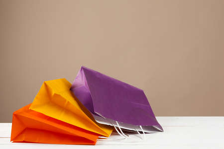 Arrangement of shopping bags on beige backgroundの写真素材