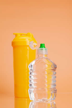 Plastic water bottles on a pastel beige backgroundの写真素材