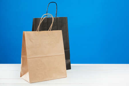 Arrangement of shopping bags on blue backgroundの写真素材
