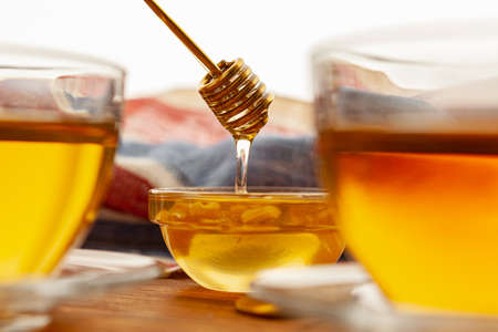 Close up of glass tea cup with honeyの写真素材