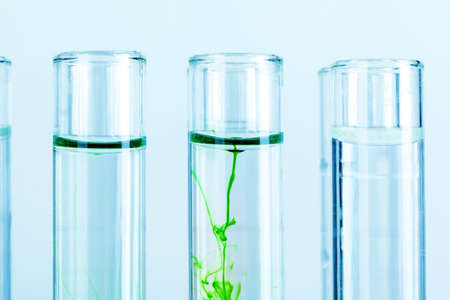 Green liquids in test tubes in chemical laboratory close upの写真素材