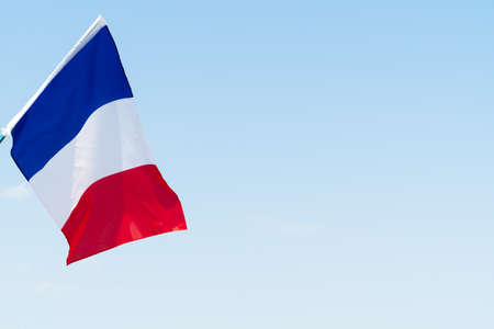 Flag of France waving in the wind in the skyの写真素材