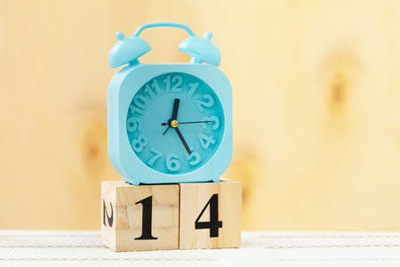 Alarm clock on wooden table close upの写真素材