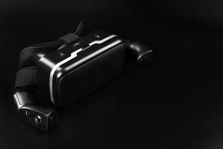 VR virtual reality glasses on a black table.の写真素材