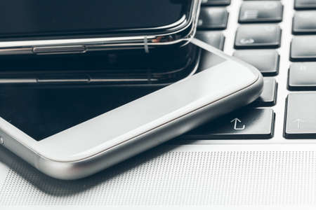 Laptop and mobile phone on the table. Workspace concept.の写真素材