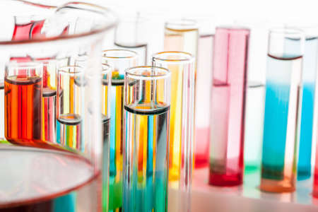 Test tubes with colorful chemicals close up in laboratoryの写真素材