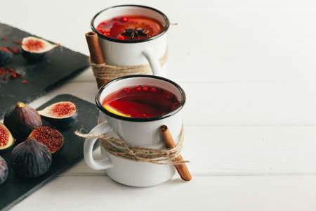 New Year composition with mulled wine on dark wooden background